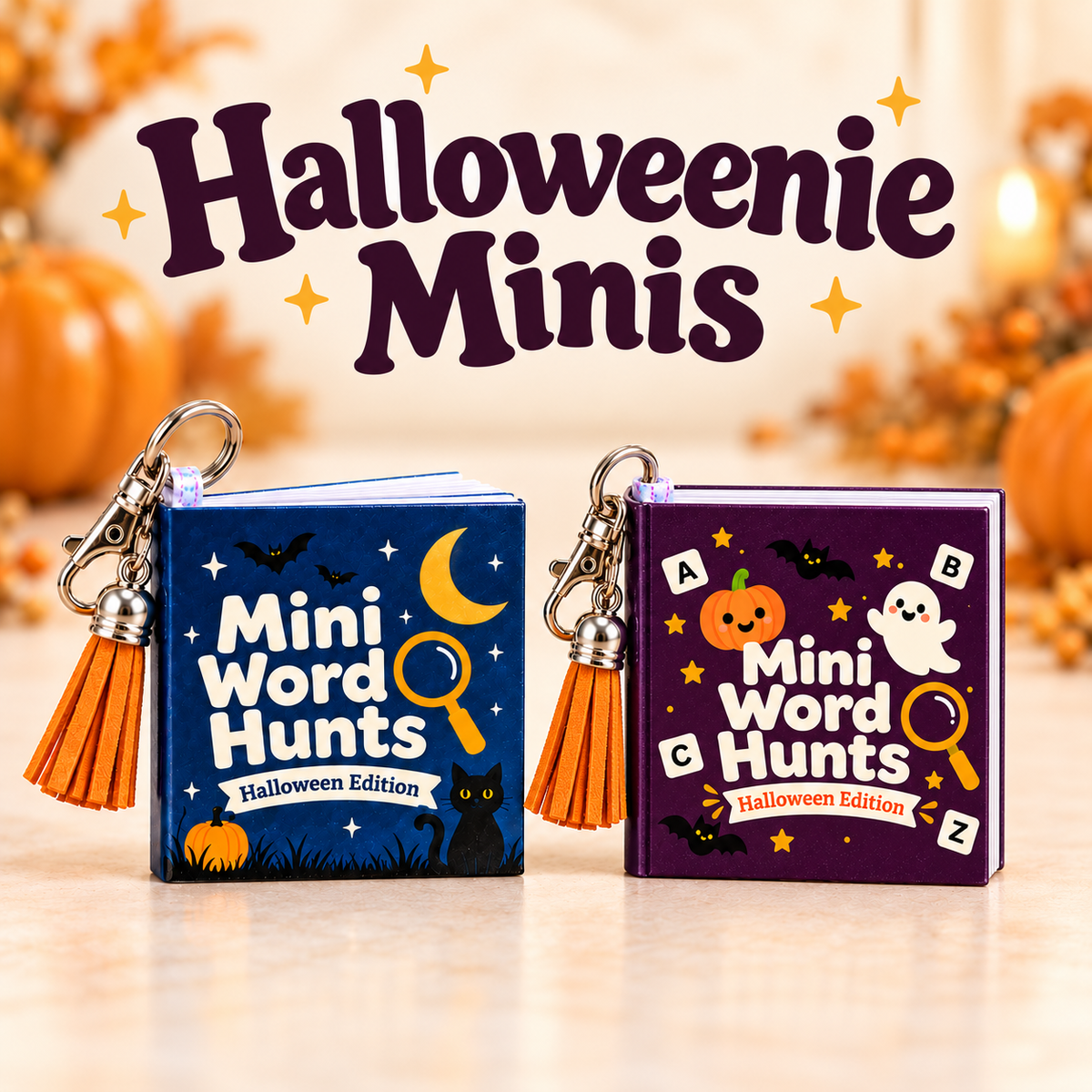 Halloweenie Minis collection featuring Moonlit Cat and Pumpkin & Ghost miniature word-search keychain books with orange tassels beneath the collection name.